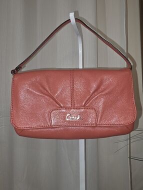 Coach Ashley Large Leather Flap Wristlet In Coral/Salmon Color.